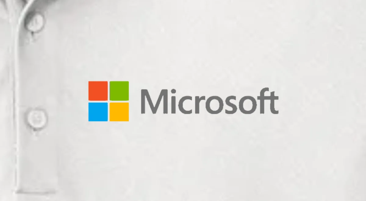 Your PNG: the Microsoft logo shown flat on the left chest of a white Nike polo