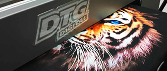 DTG digital printer producing a full-color tiger print on fabric